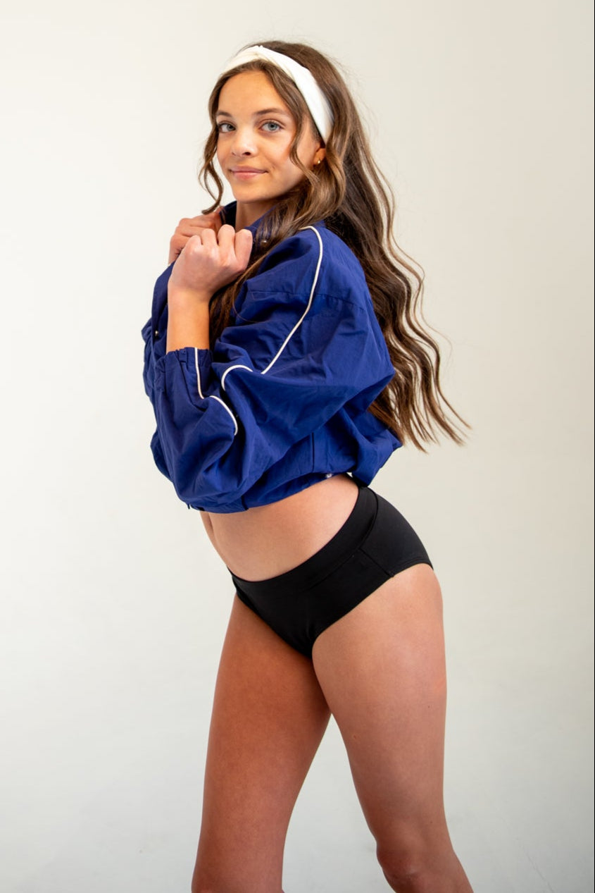 Girl wearing period and incontinence dance briefs
