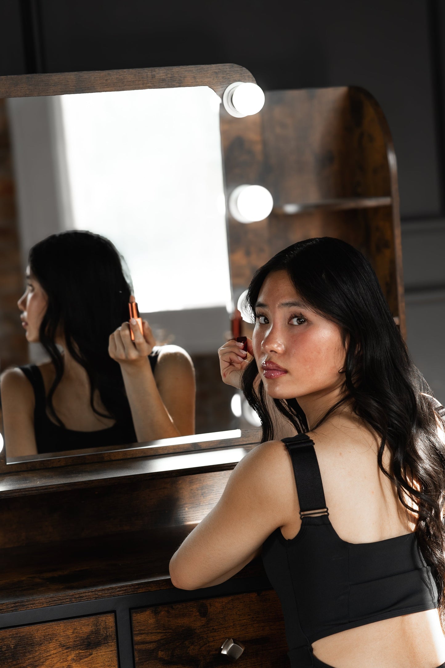 Girl in a black period and incontinence liner leotard with built-in bra and adjustable straps